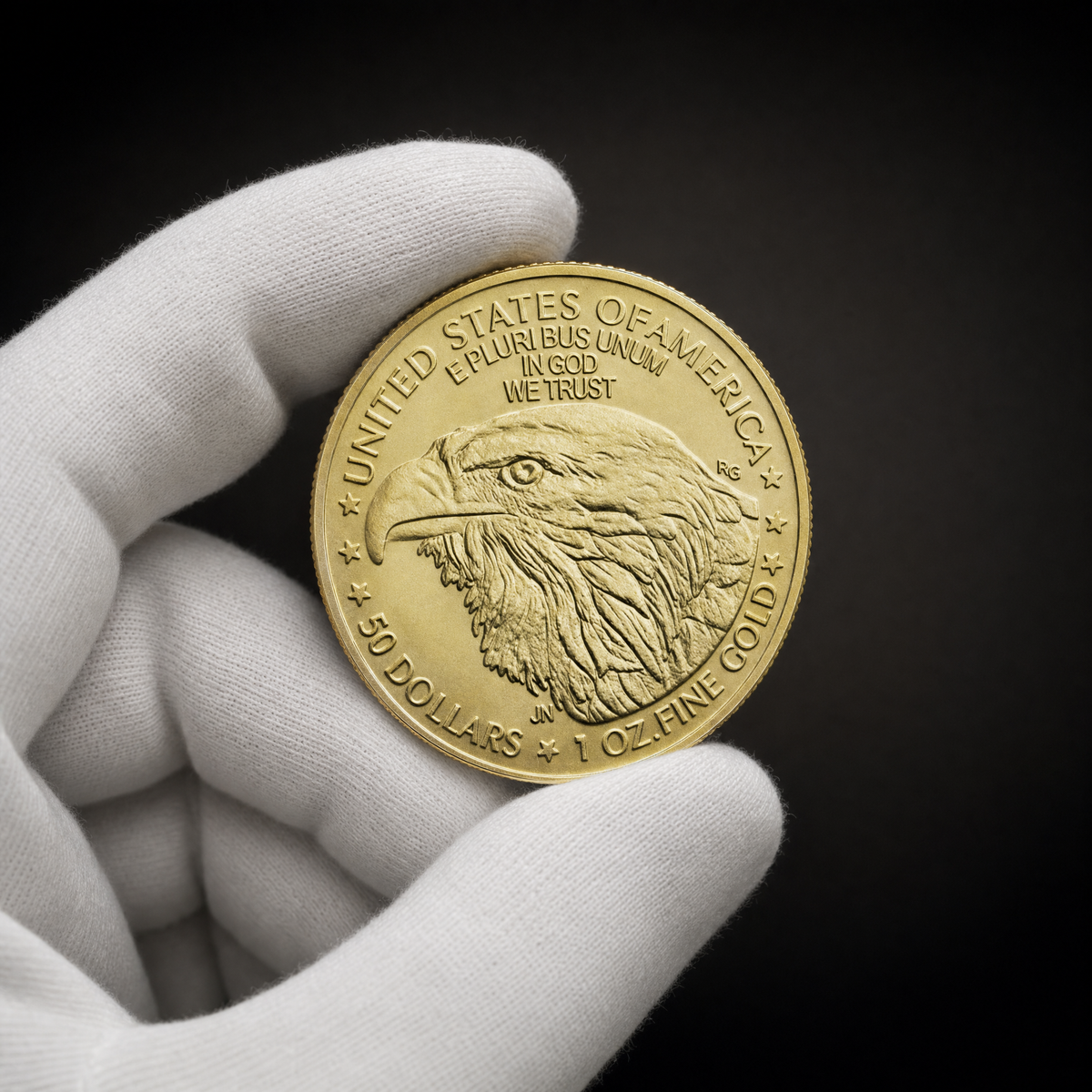 Liberty 2026 Coin Radiance Edition held in a white cotton conservator glove, reverse toward the camera