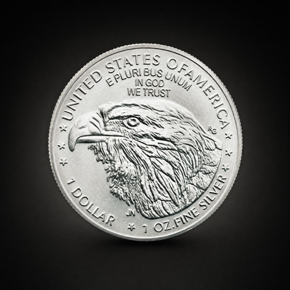 Liberty 2026 Coin Lustre Edition, reverse, an eagle head with UNITED STATES OF AMERICA above and the struck legends 1 DOLLAR and 1 OZ. FINE SILVER across the foot, reproduced as they appear on the piece