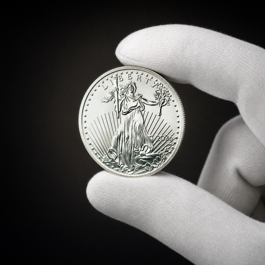 Liberty 2026 Coin Lustre Edition held in a white cotton conservator glove, obverse toward the camera