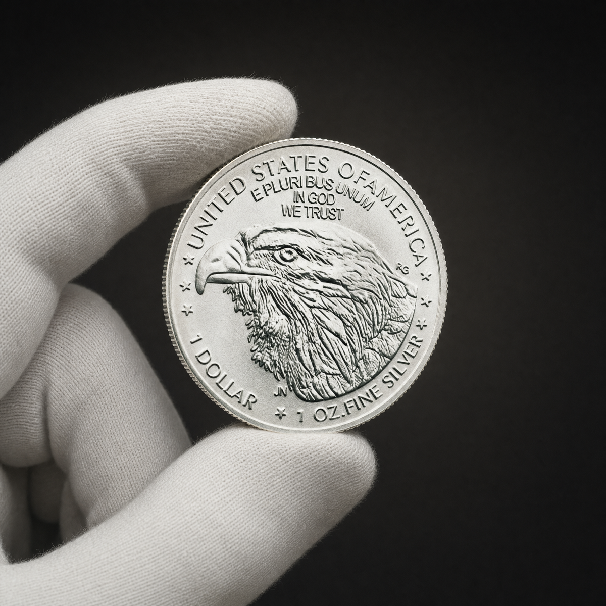 Liberty 2026 Coin Lustre Edition held in a white cotton conservator glove, reverse toward the camera