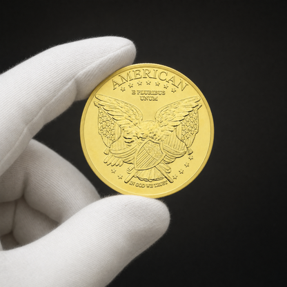 Liberty Coin Guardian Edition held in a white cotton conservator glove, reverse toward the camera