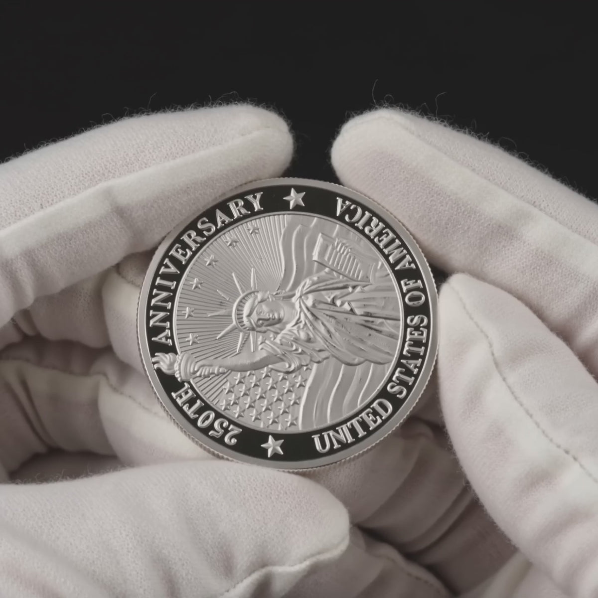 Five second video of the Liberty 250 Coin Legacy Edition turned slowly in white cotton conservator gloves